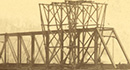 Hot Metal Bridge (1887-present) over the Monongahela River as it appeared under construction in 1887. Engineer: William Glyde Wilkins— Photograph from the <a href='https://historicpittsburgh.org/collection/frederick-t-gretton-photographs' target='_blank'> Frederick T. Gretton, Photographs, 1857-1953, MSP #328, Library & Archives, Senator John Heinz History Center</a>
