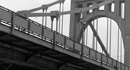 Sixth Street Bridge (1928-present), also known as the Roberto Clemente Bridge, over the Allegheny River as it appeared about 1950.  Architect: Stanley L. Roush - Engineer: County of Allegheny — Photograph from the <a href='https://historicpittsburgh.org/collection/paul-slantis-photographs' target='_blank'> Paul Slantis Photograph Collection, ca. 1946-1956, AIS.1911.19a, Archives Service Center, University of Pittsburgh</a>